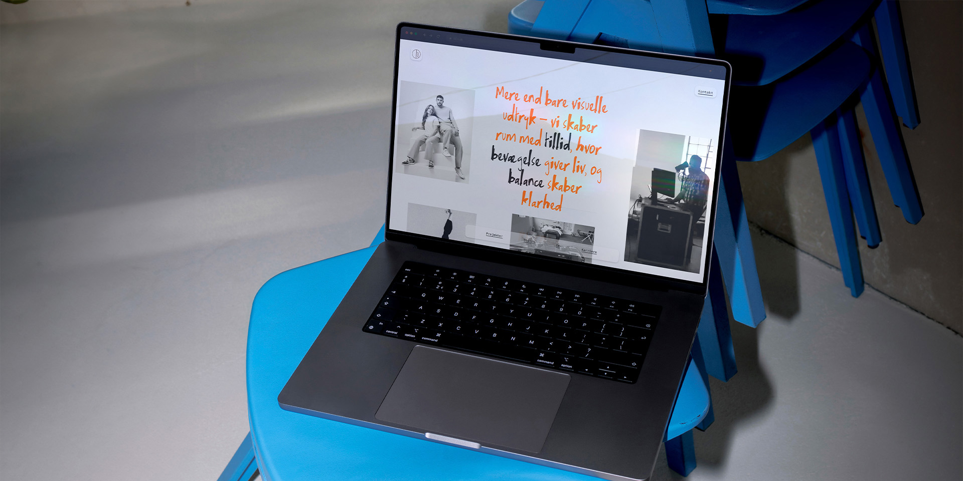 The new Blue Room Production website on a laptop, on a blue chair